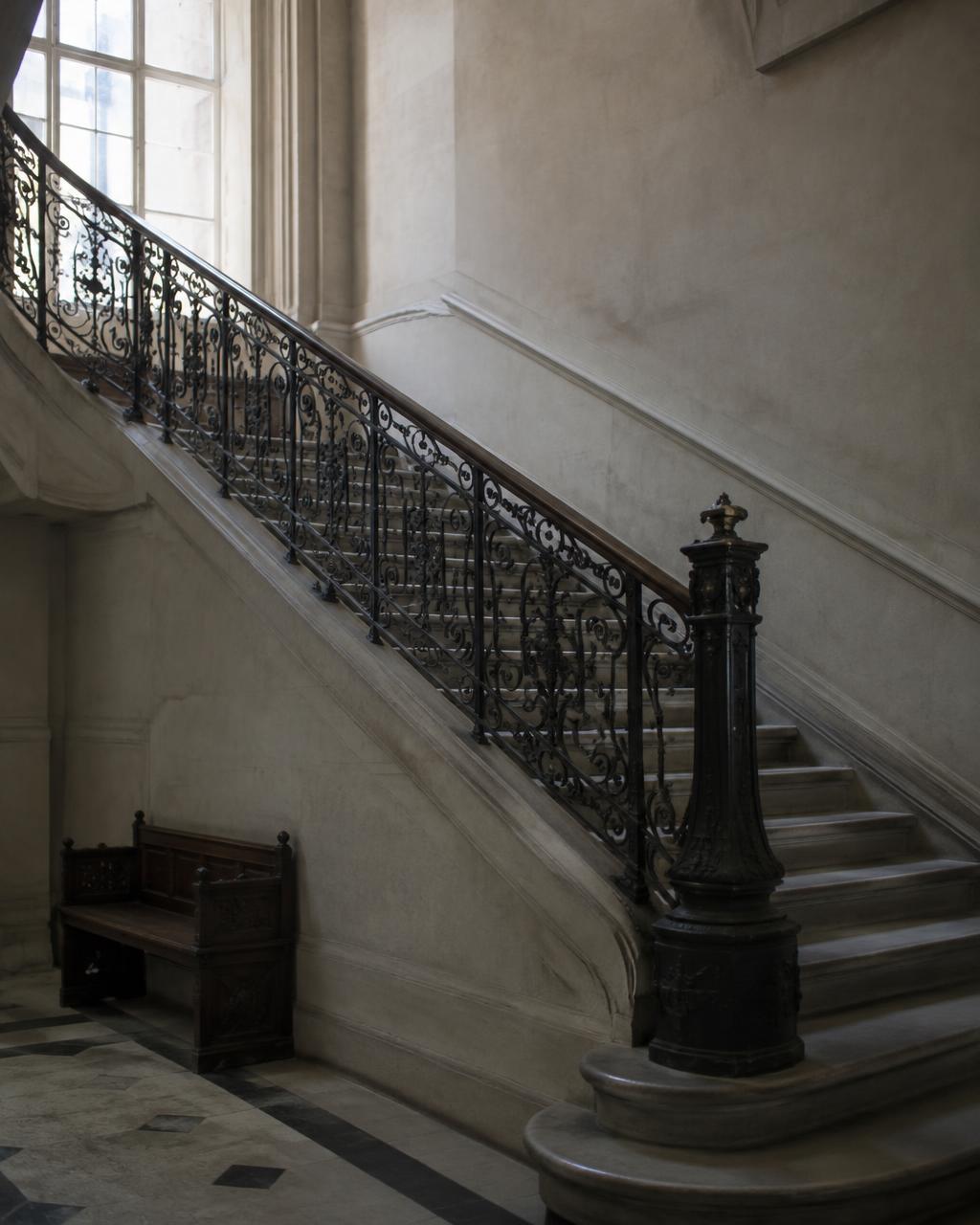 Stone staircase with wrought iron balustrade